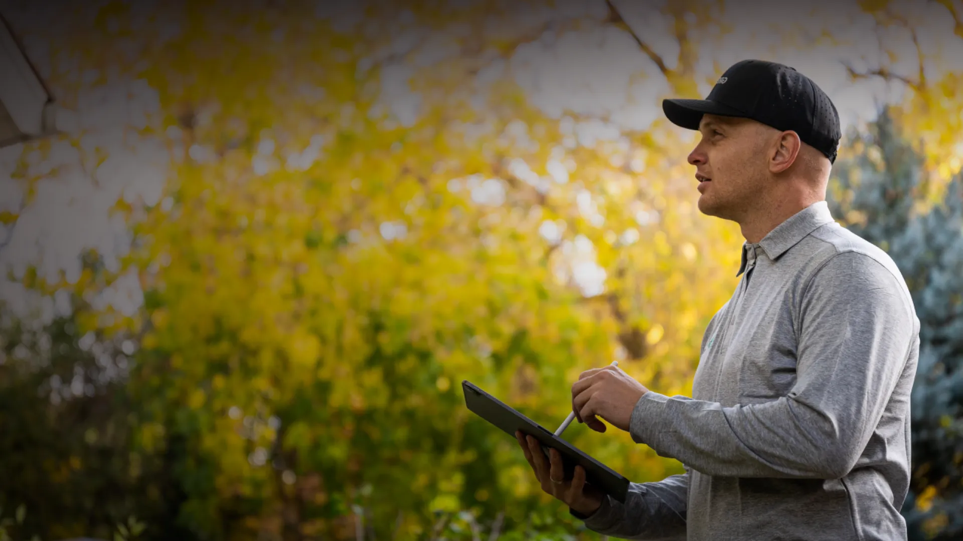 a man holding a tablet