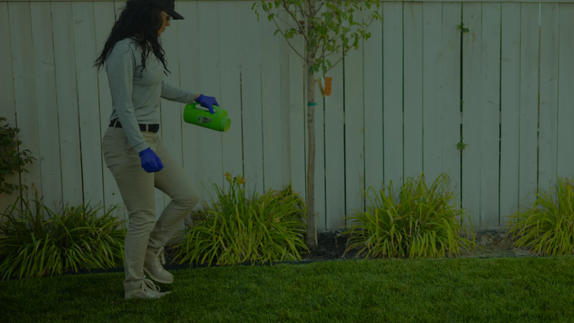 a person holding a watering can