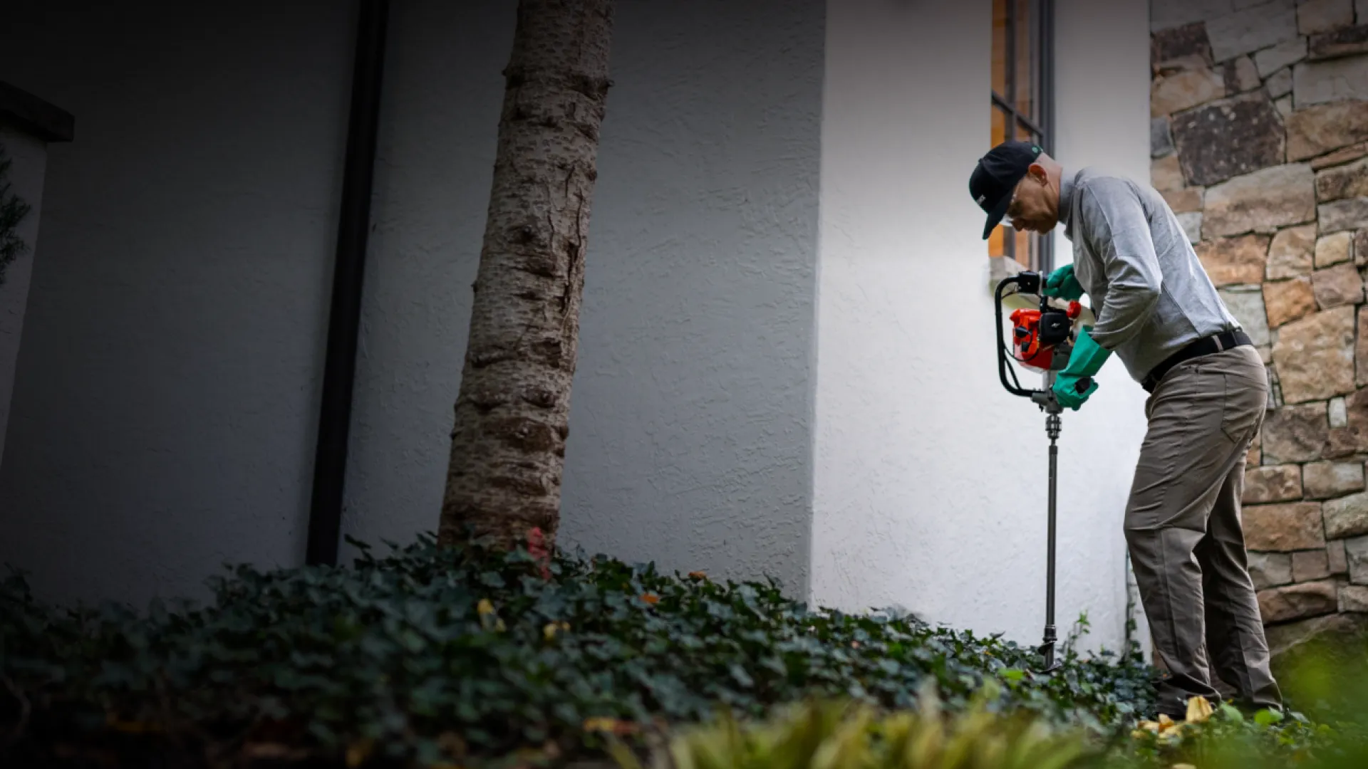 Pest Technician treating the shrubs