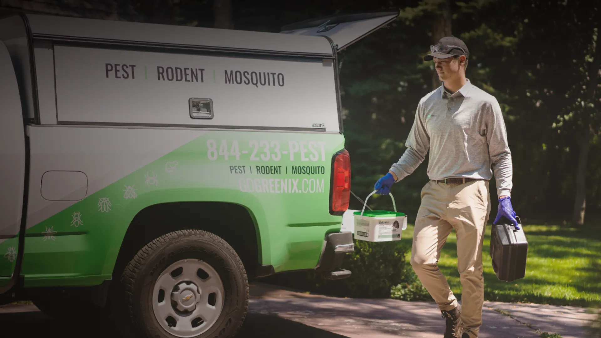 Pest Technician getting equipment from truck