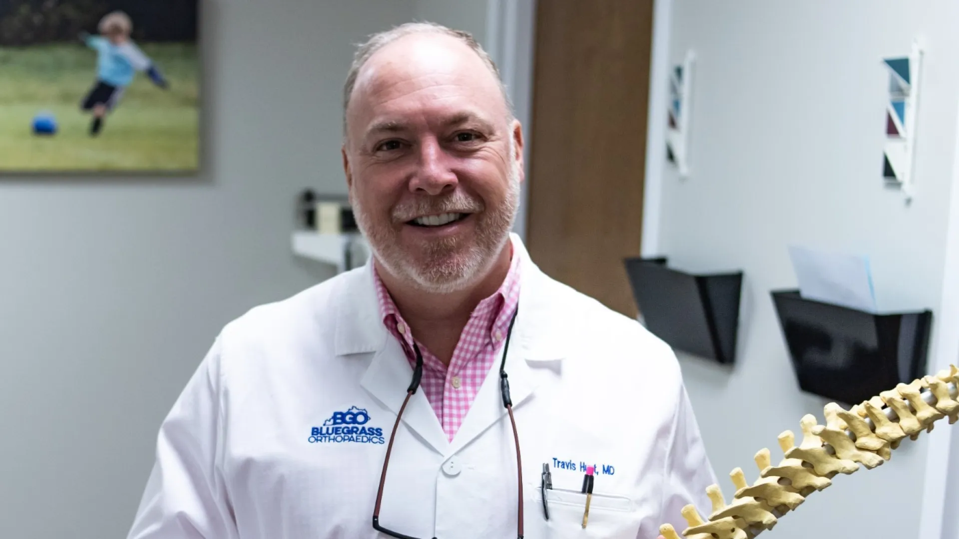 a man wearing a white coat