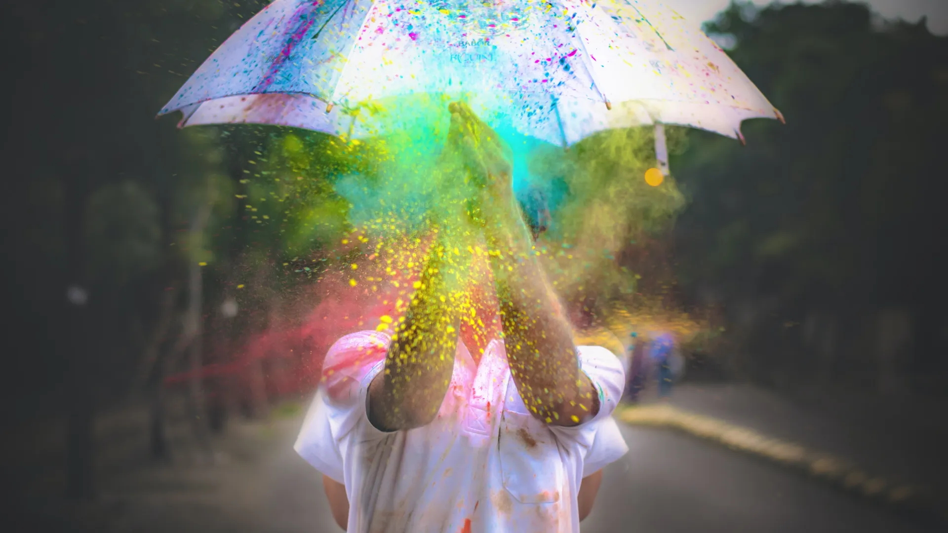 a person holding a colorful umbrella