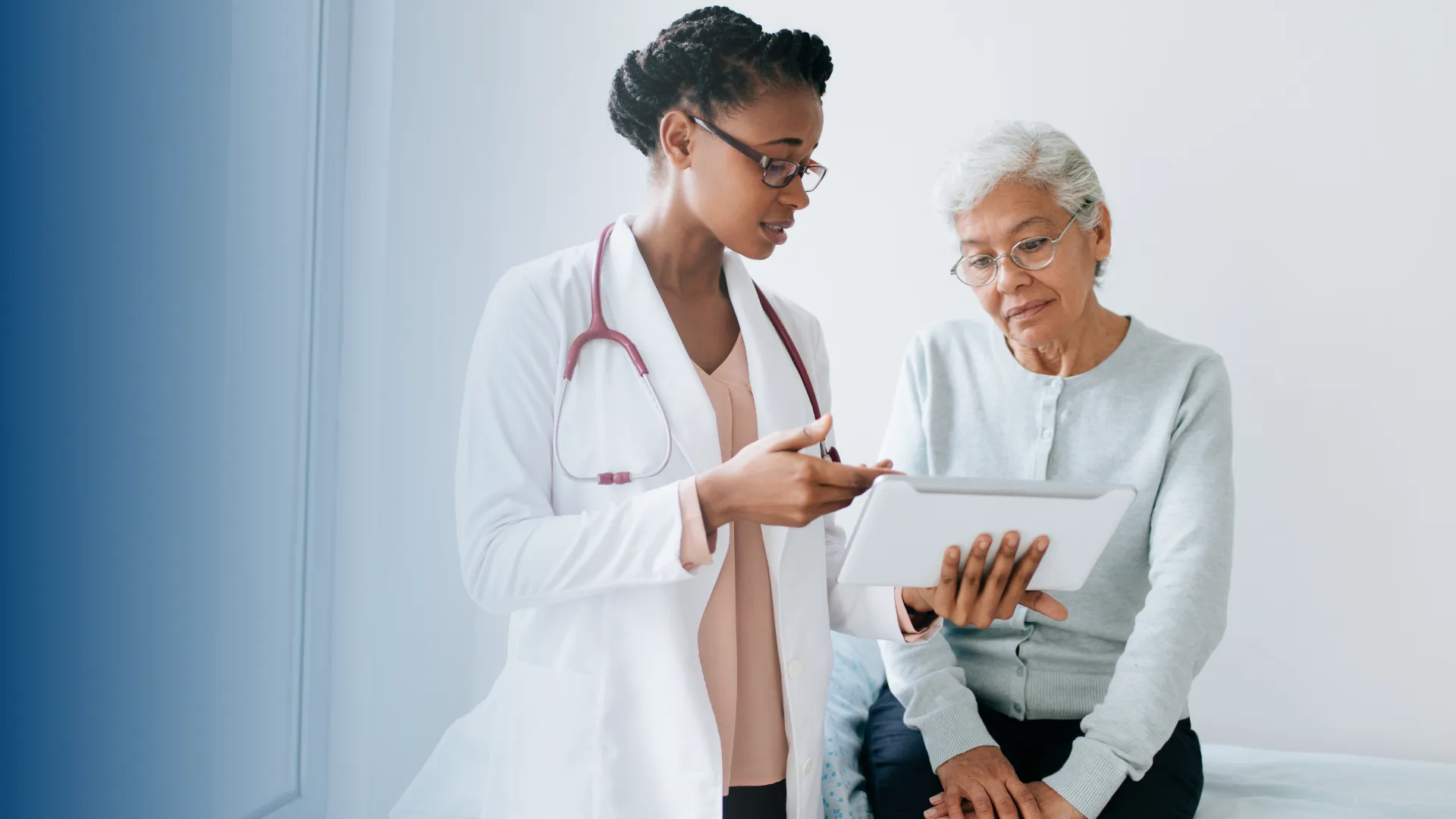 Doctor helping a elderly woman