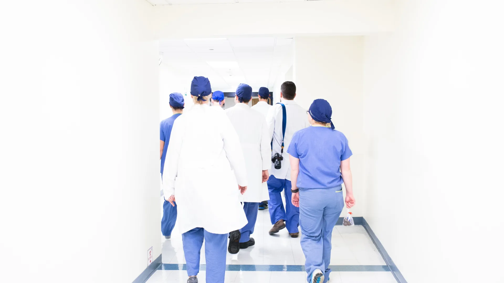 a group of people standing in a room