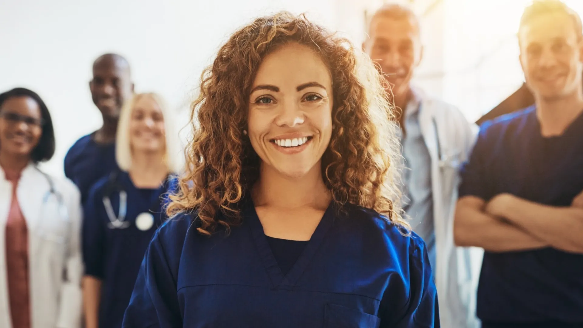 a group of medical professional pose for the camera