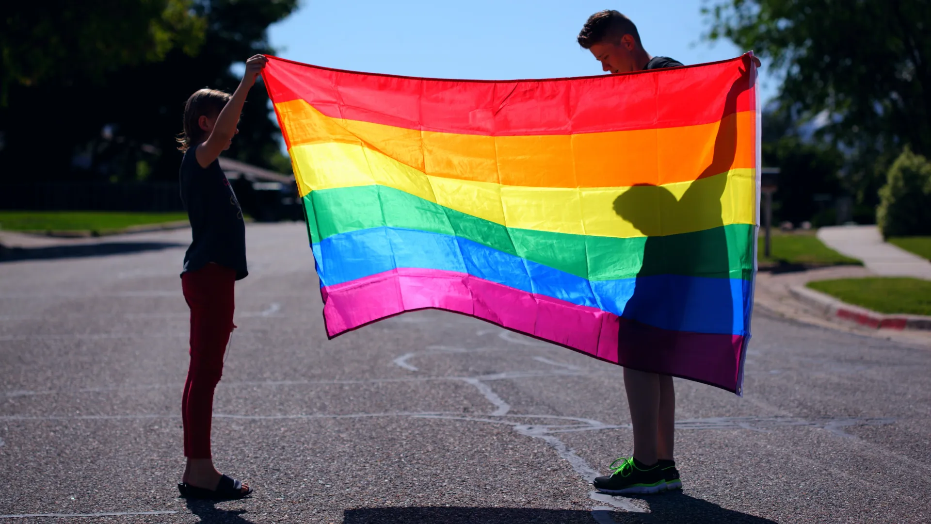 a person holding a colorful kite