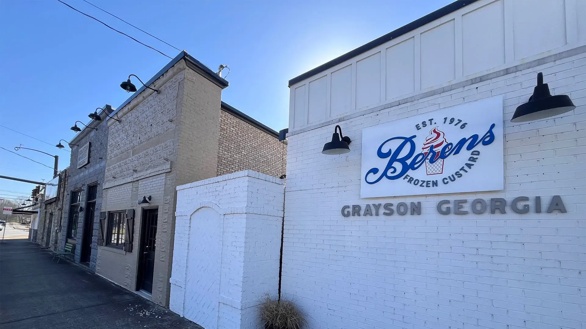 Exterior of Berens Frozen Custard shop in Grayson, Georgia, with clear sky and brick building facade.