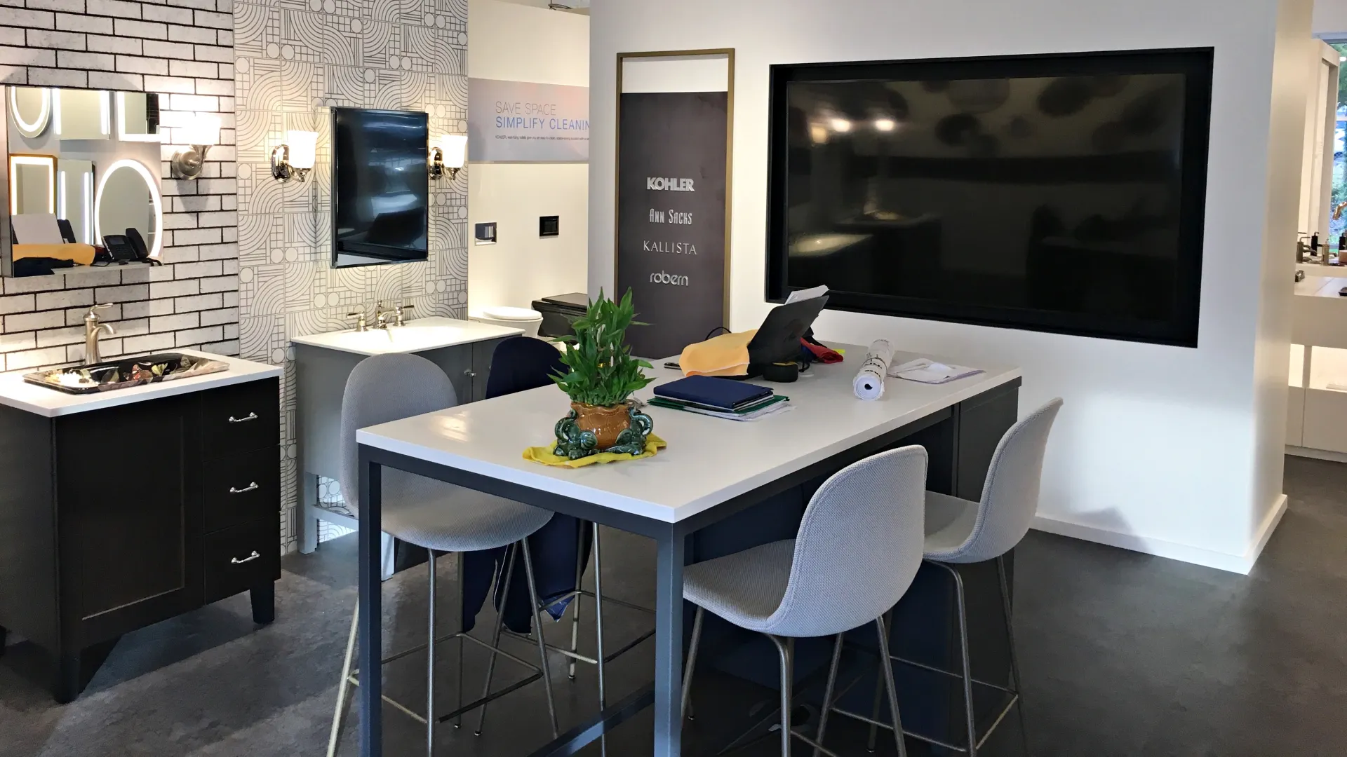 Modern kitchen showroom featuring stylish fixtures, cabinetry, and contemporary design elements.