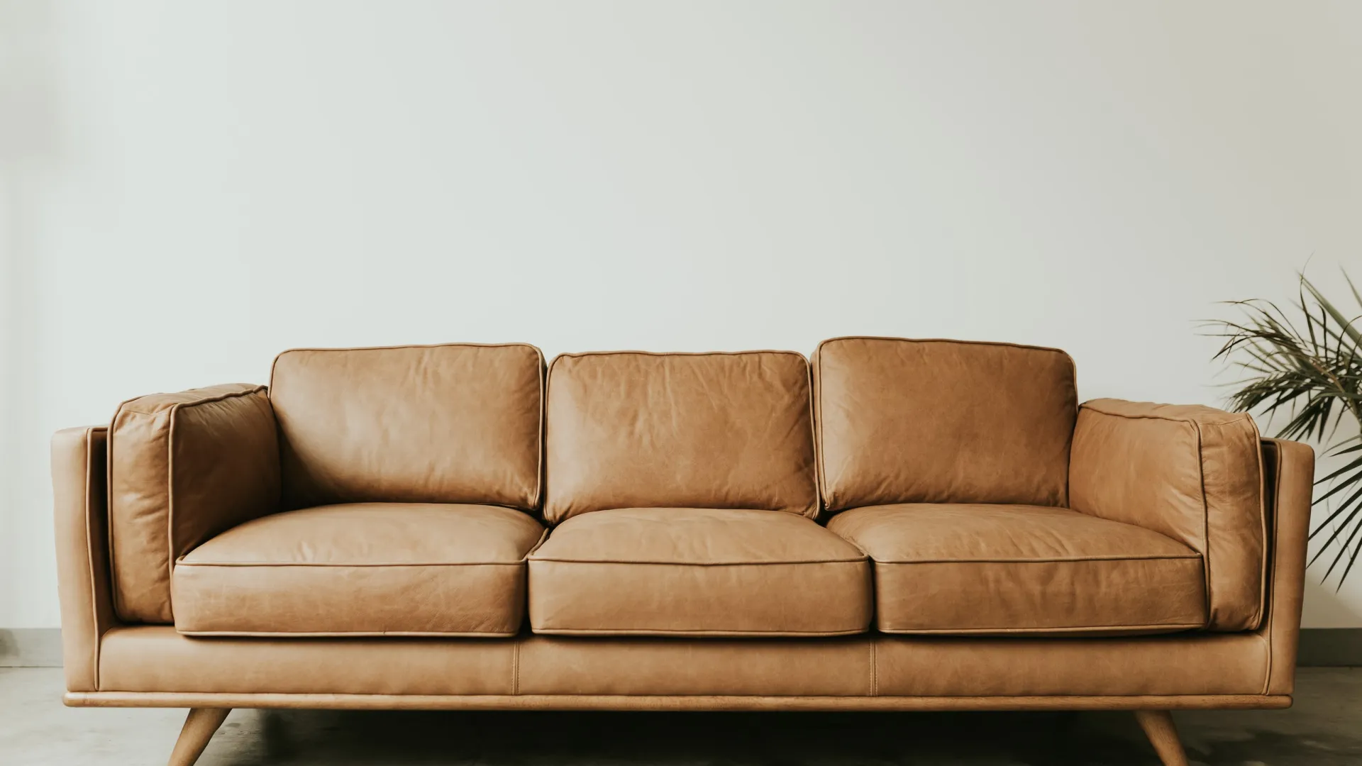 a green couch in a room