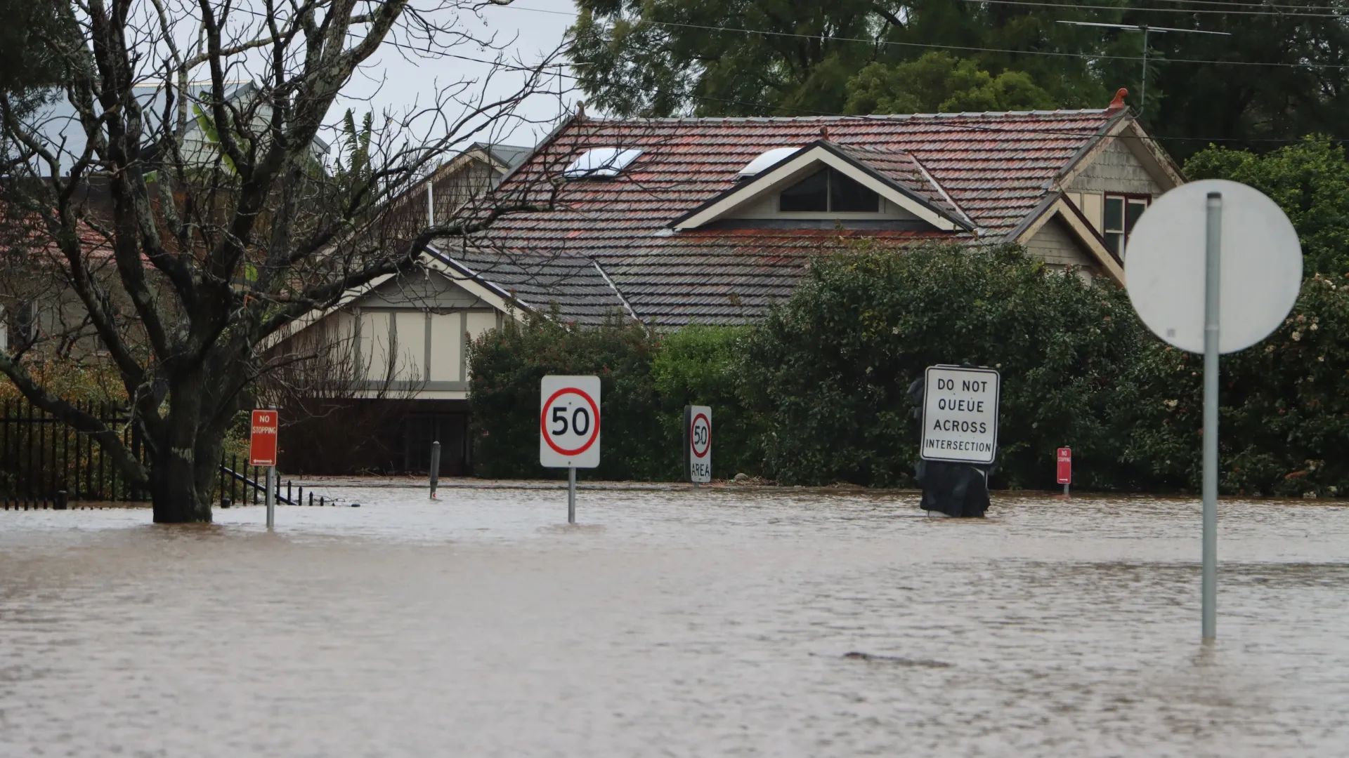 a house with a sign in front of it