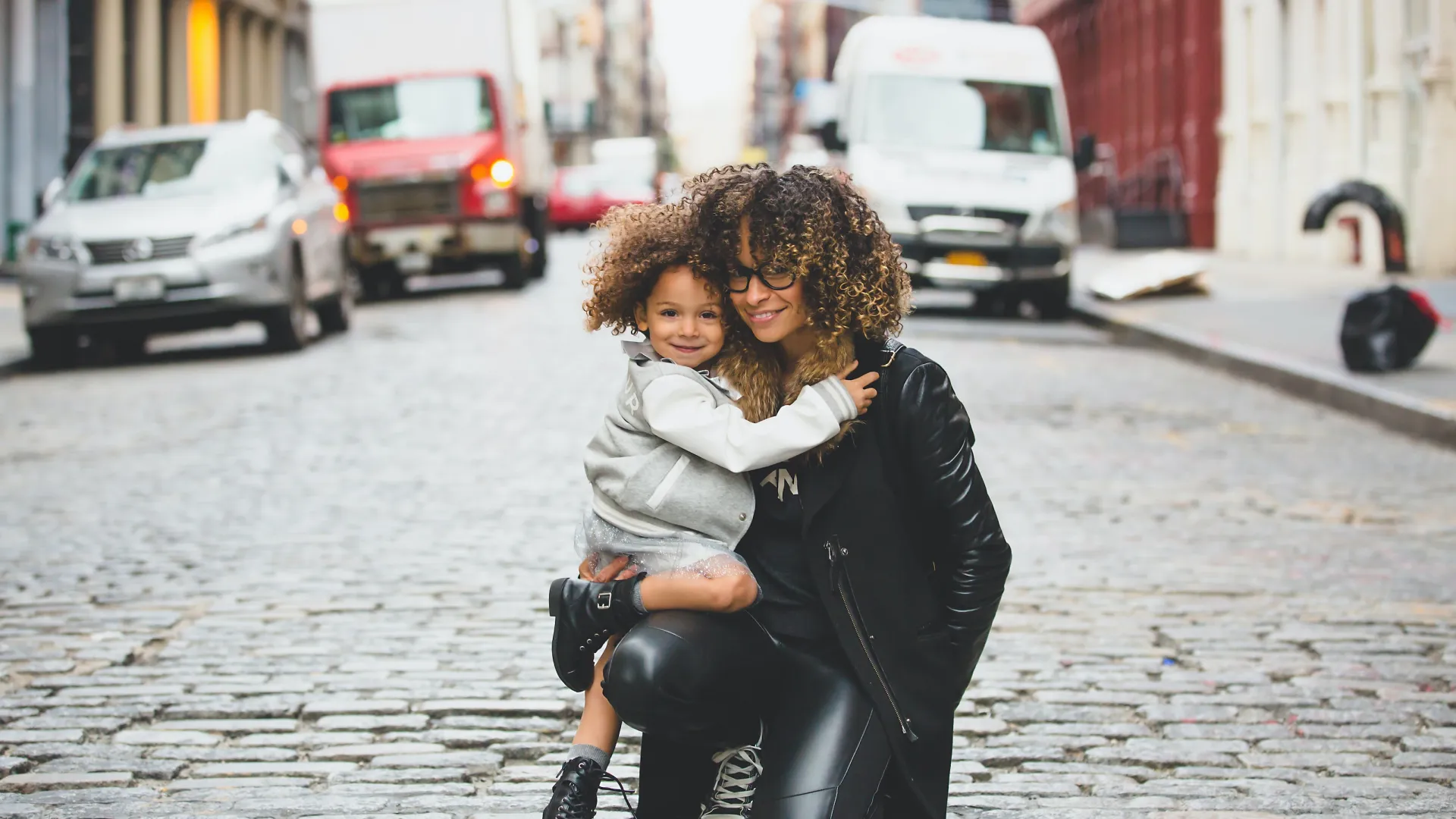 a woman carrying a child on her back