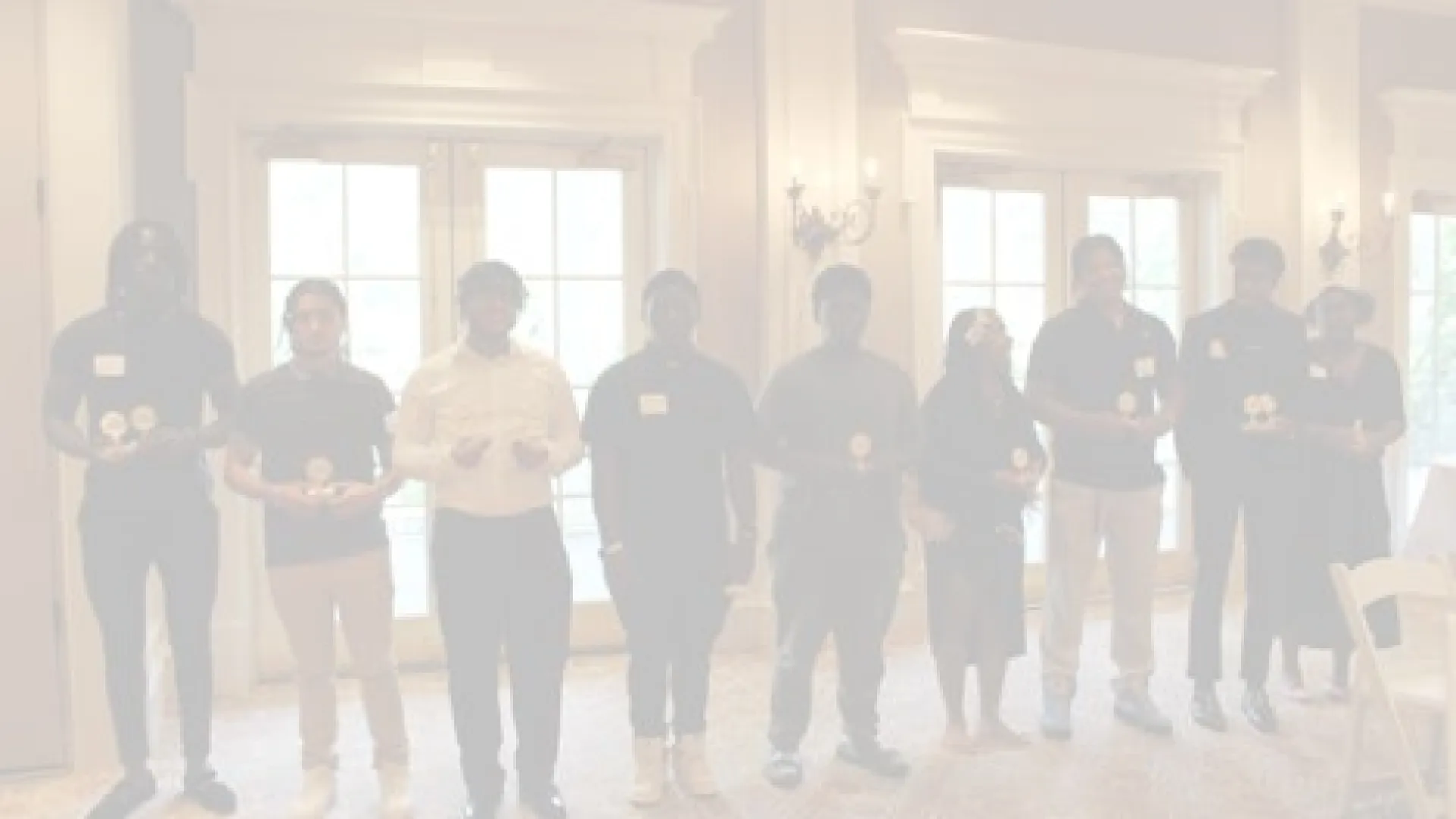 a group of people standing in a room