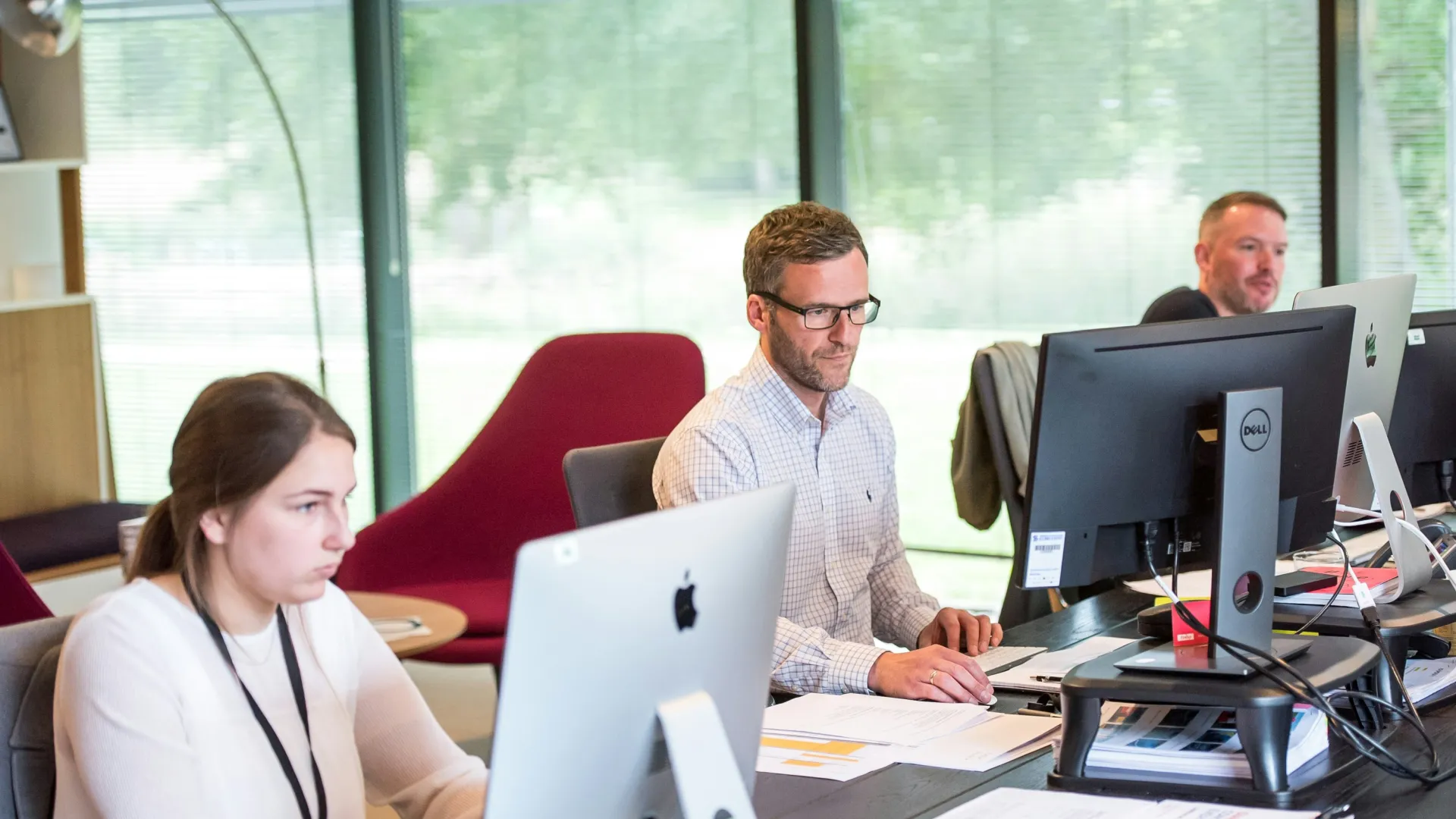 a few people working at a computer