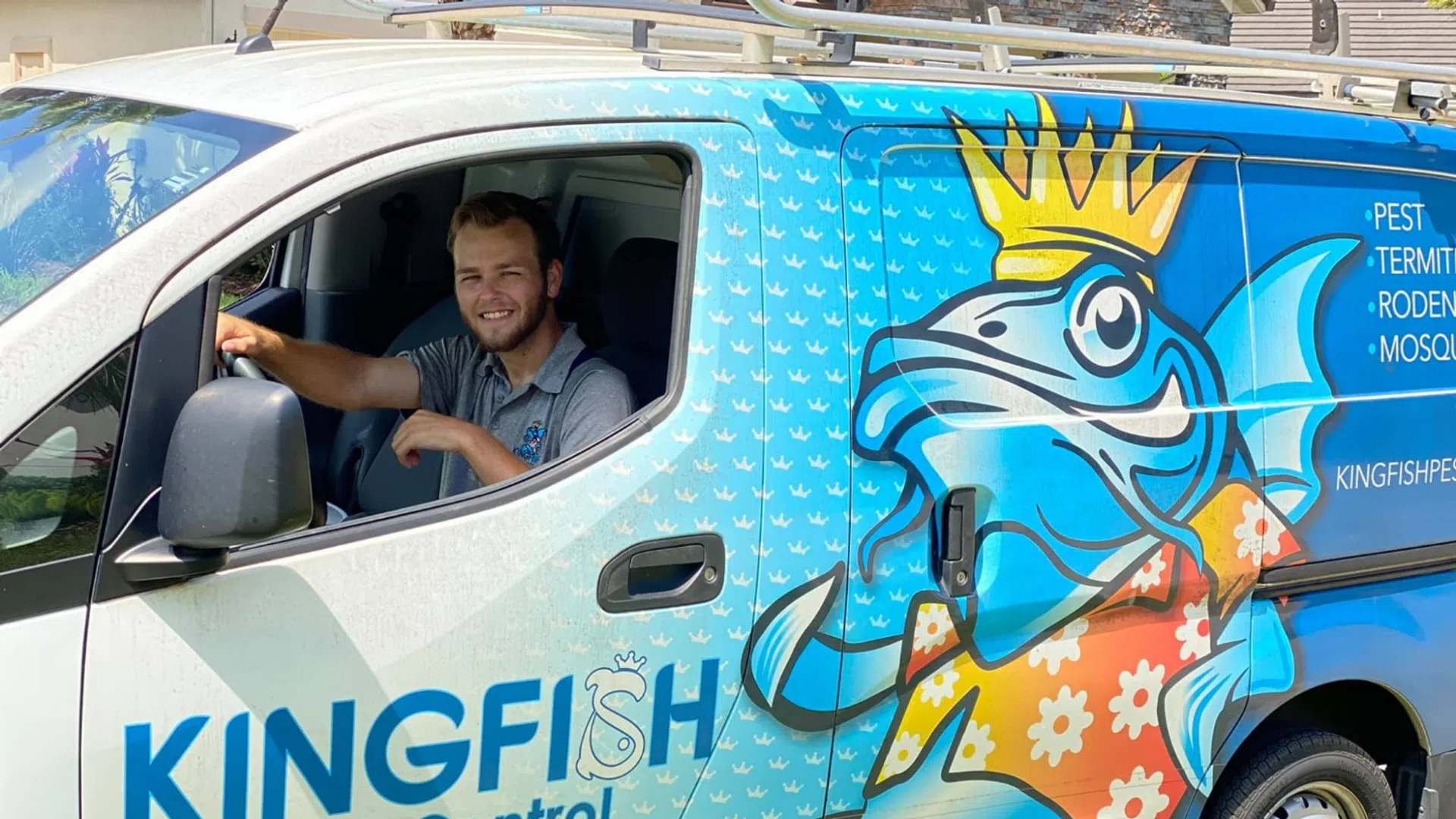a blue bus parked on the side of a van
