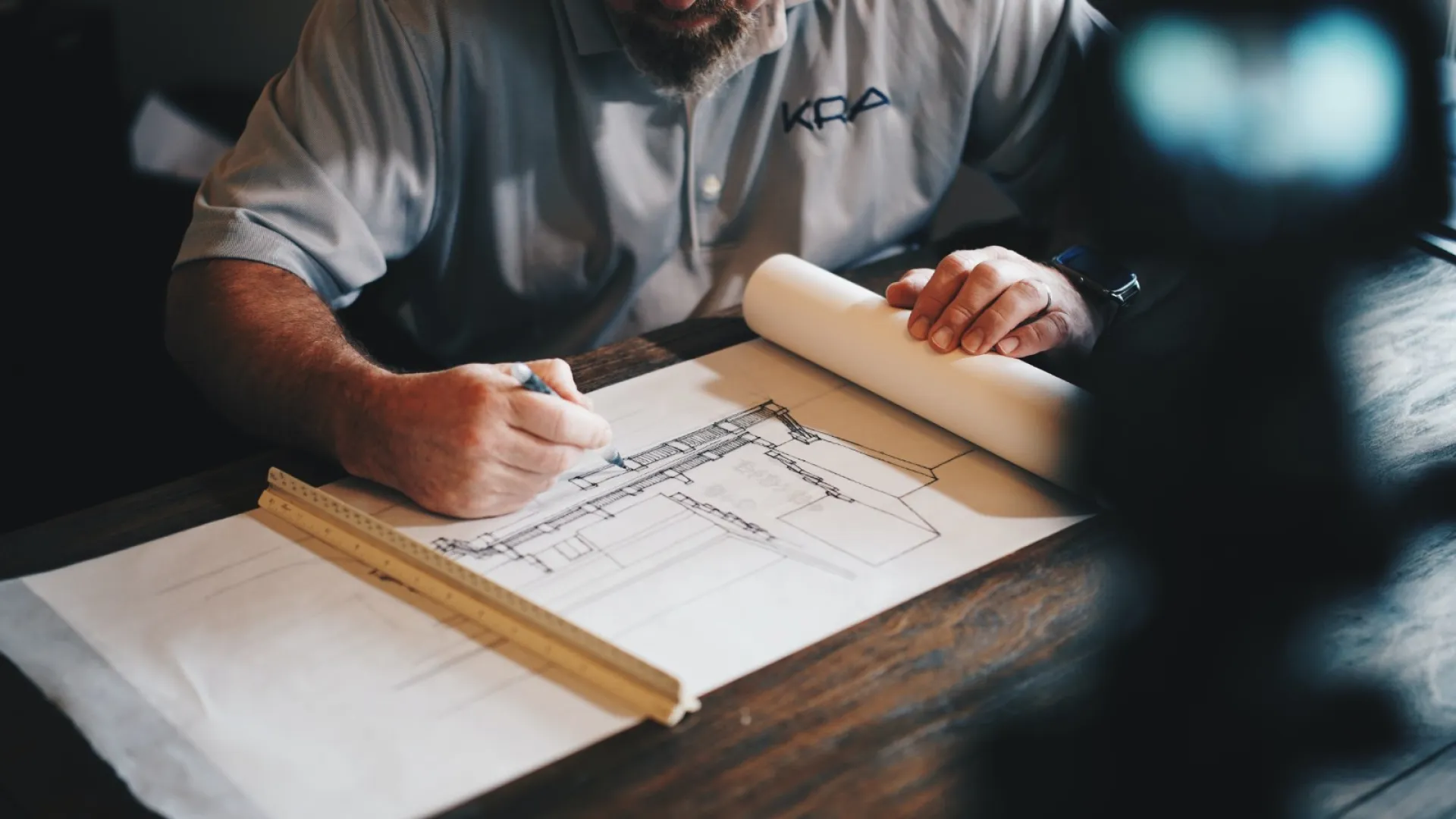 a man working on a blueprint