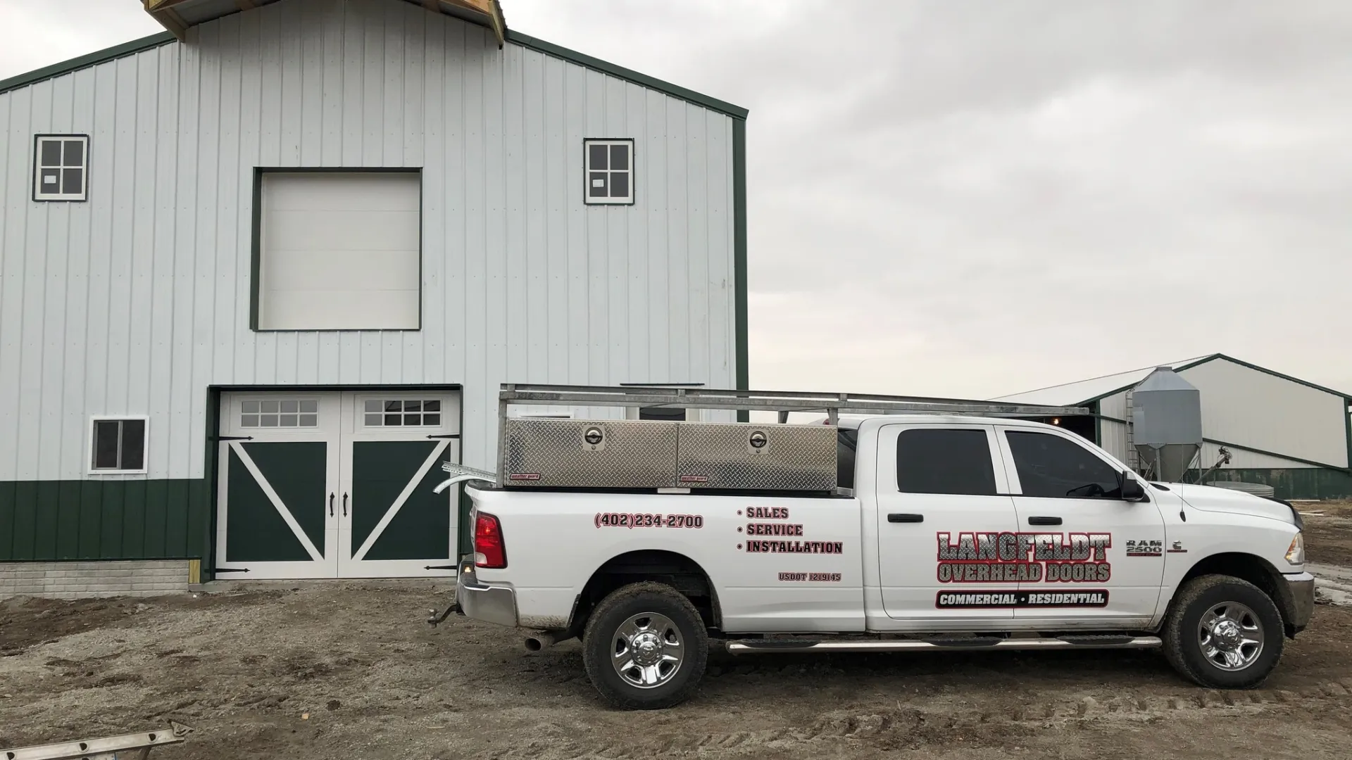 a white truck parked in front of a building