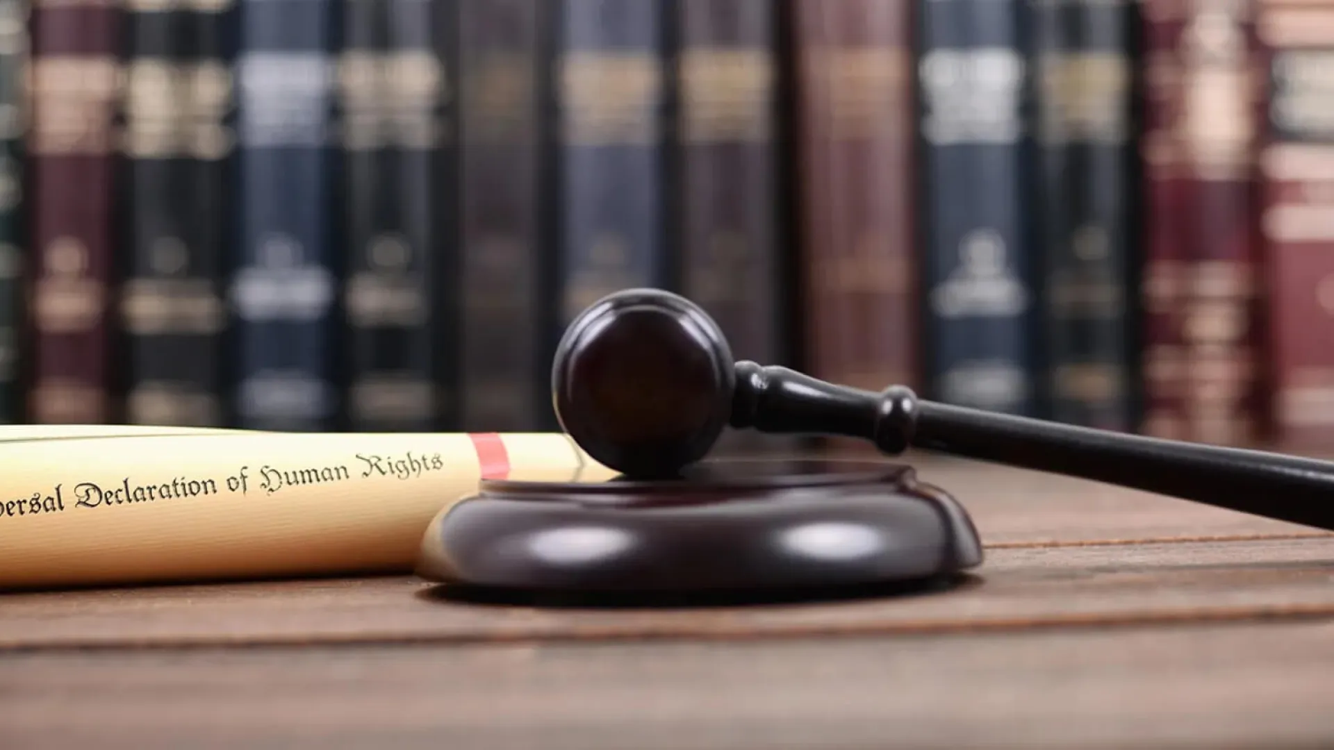 a gavel on a wooden surface