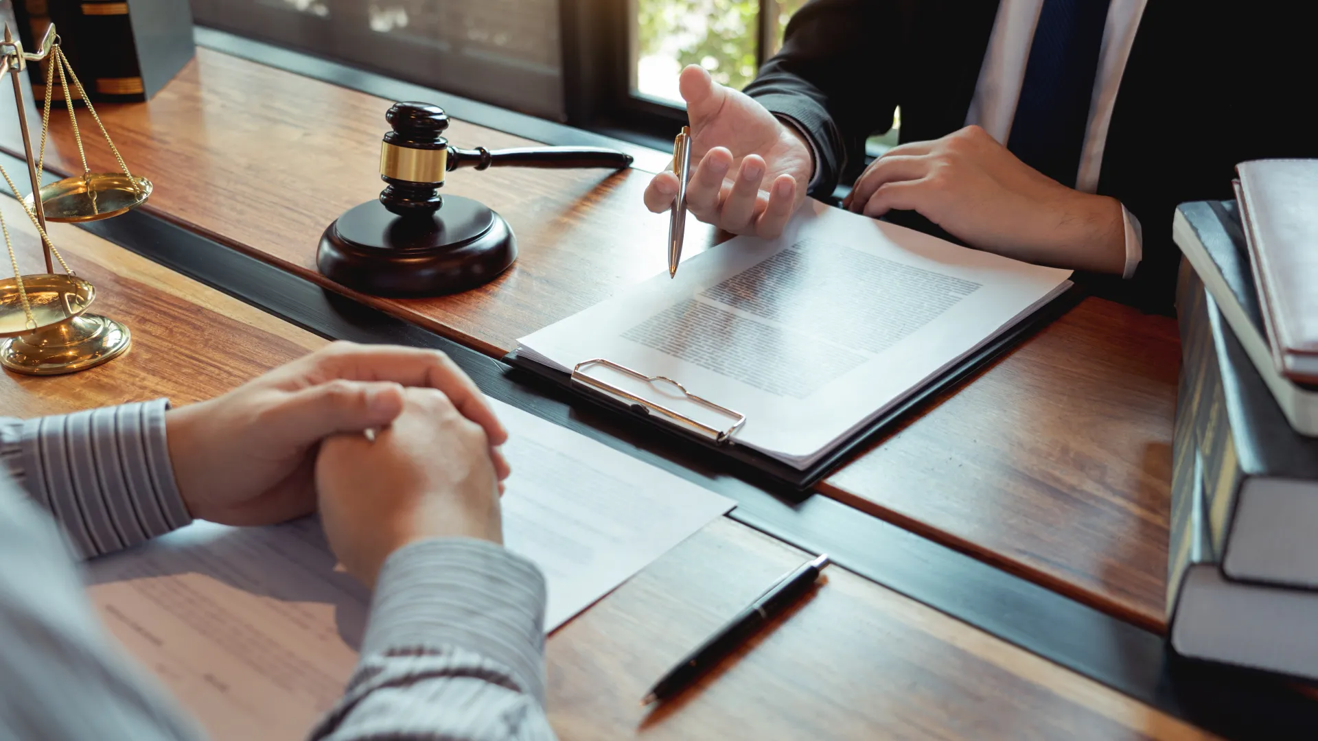 lawyer reviewing a document to be signed with client