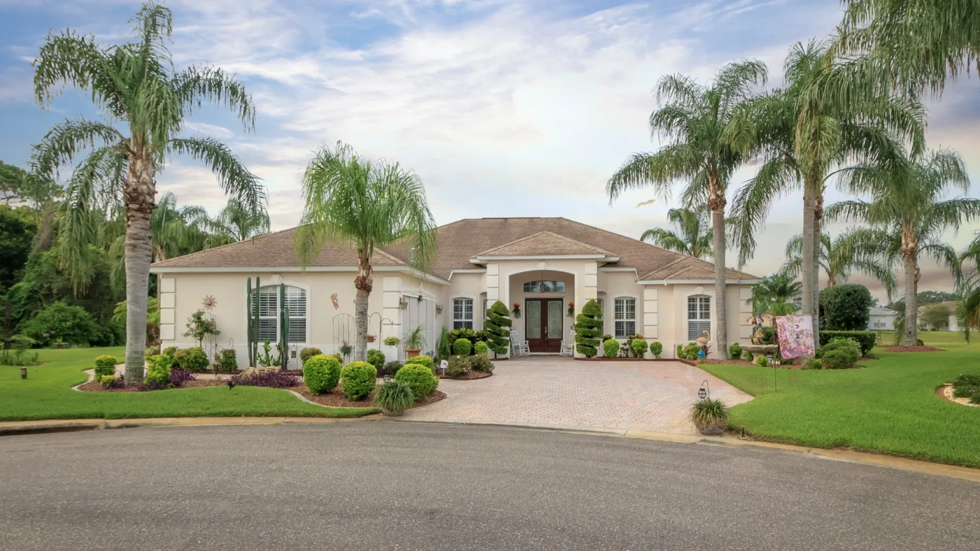 palm trees in front of a house