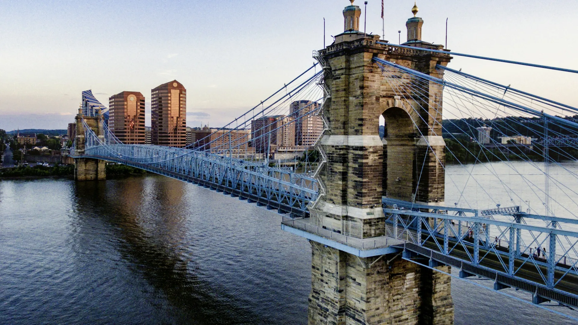 a bridge with towers over water