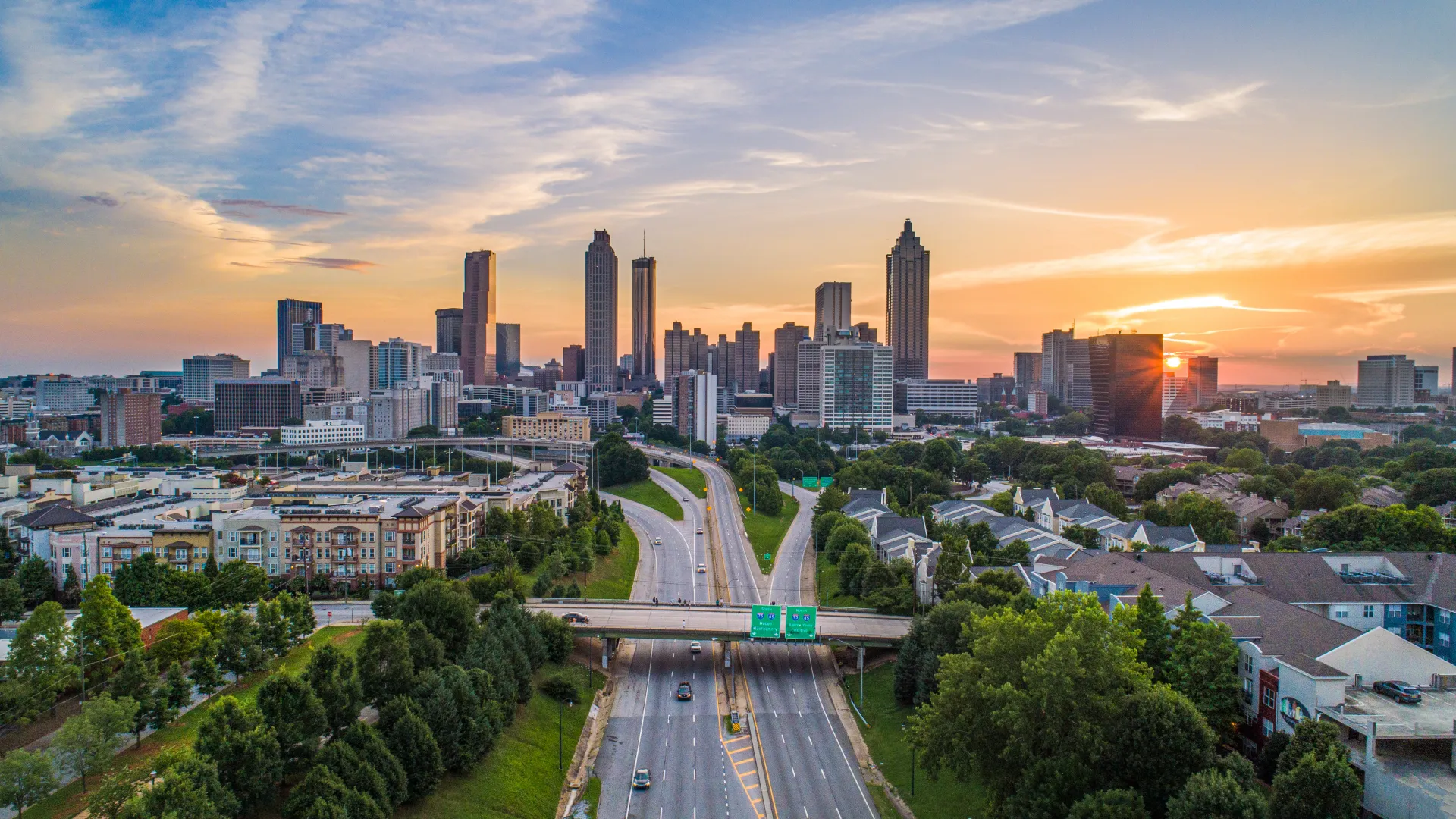 a city with a freeway and trees