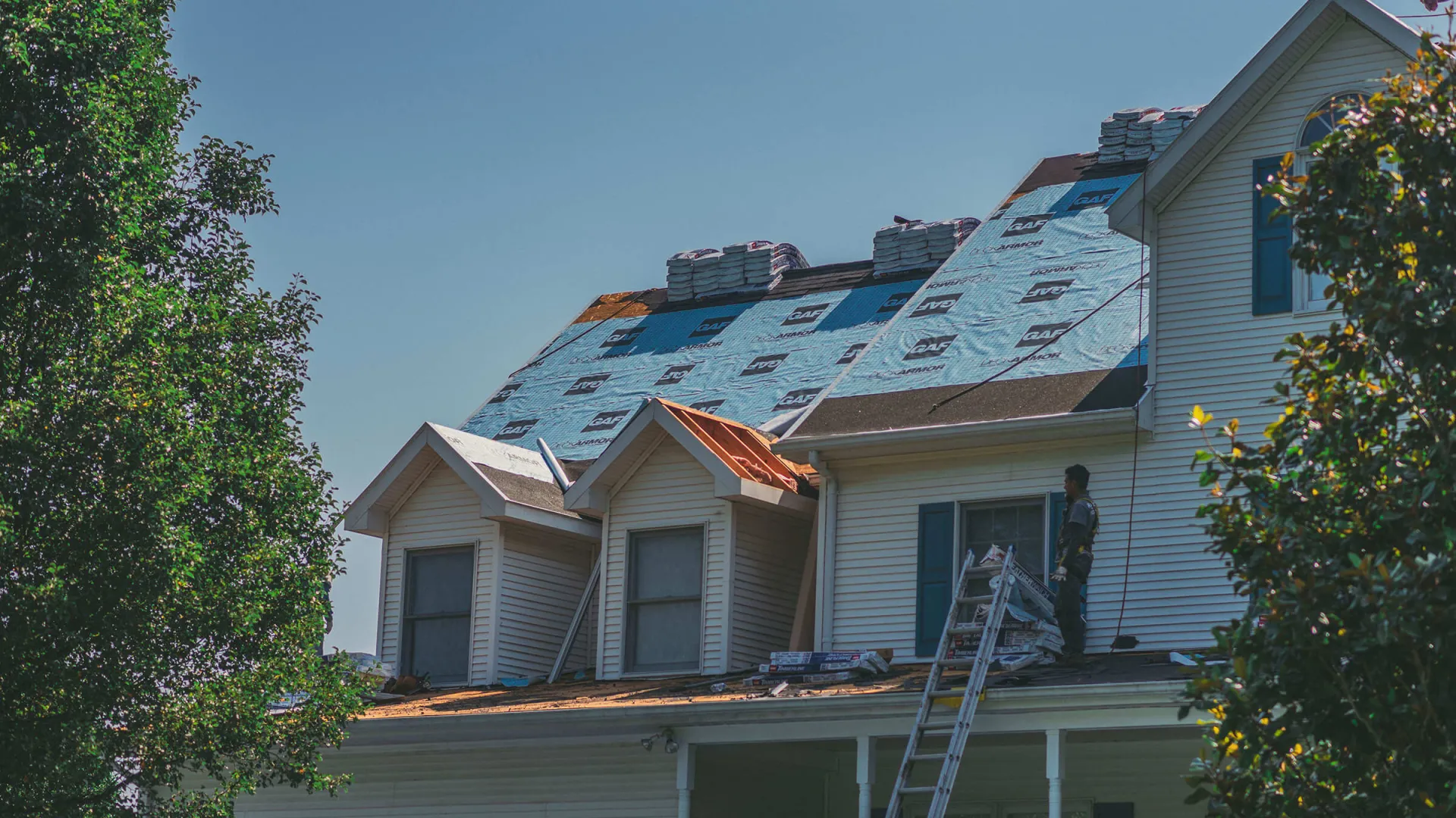 a house with a ladder on the roof