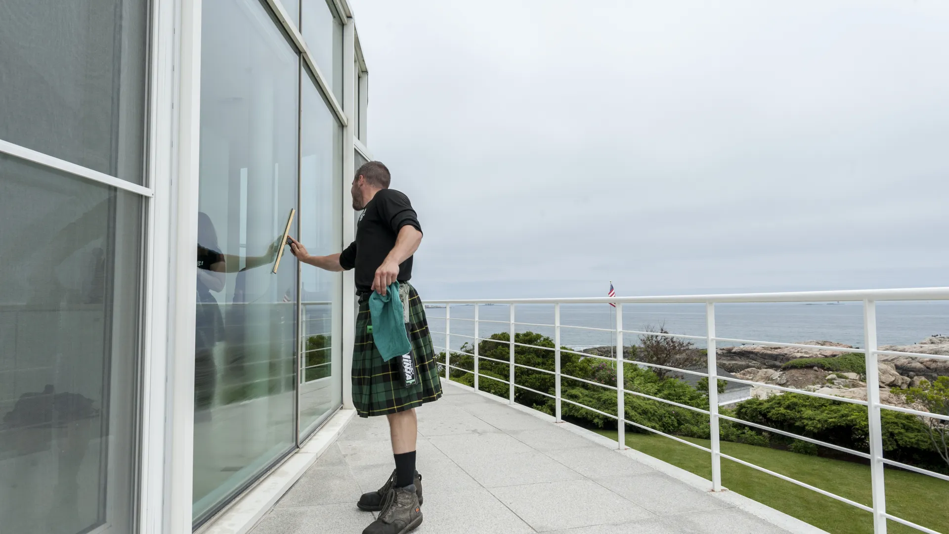 a man standing on a balcony