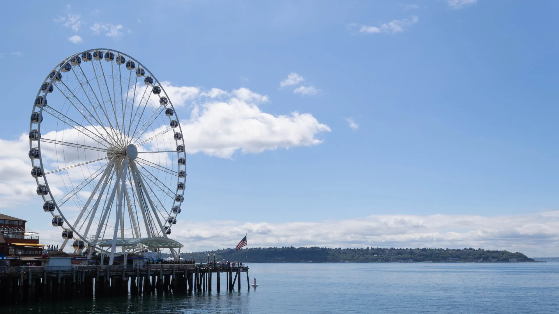 a ferris wheel by a body of water