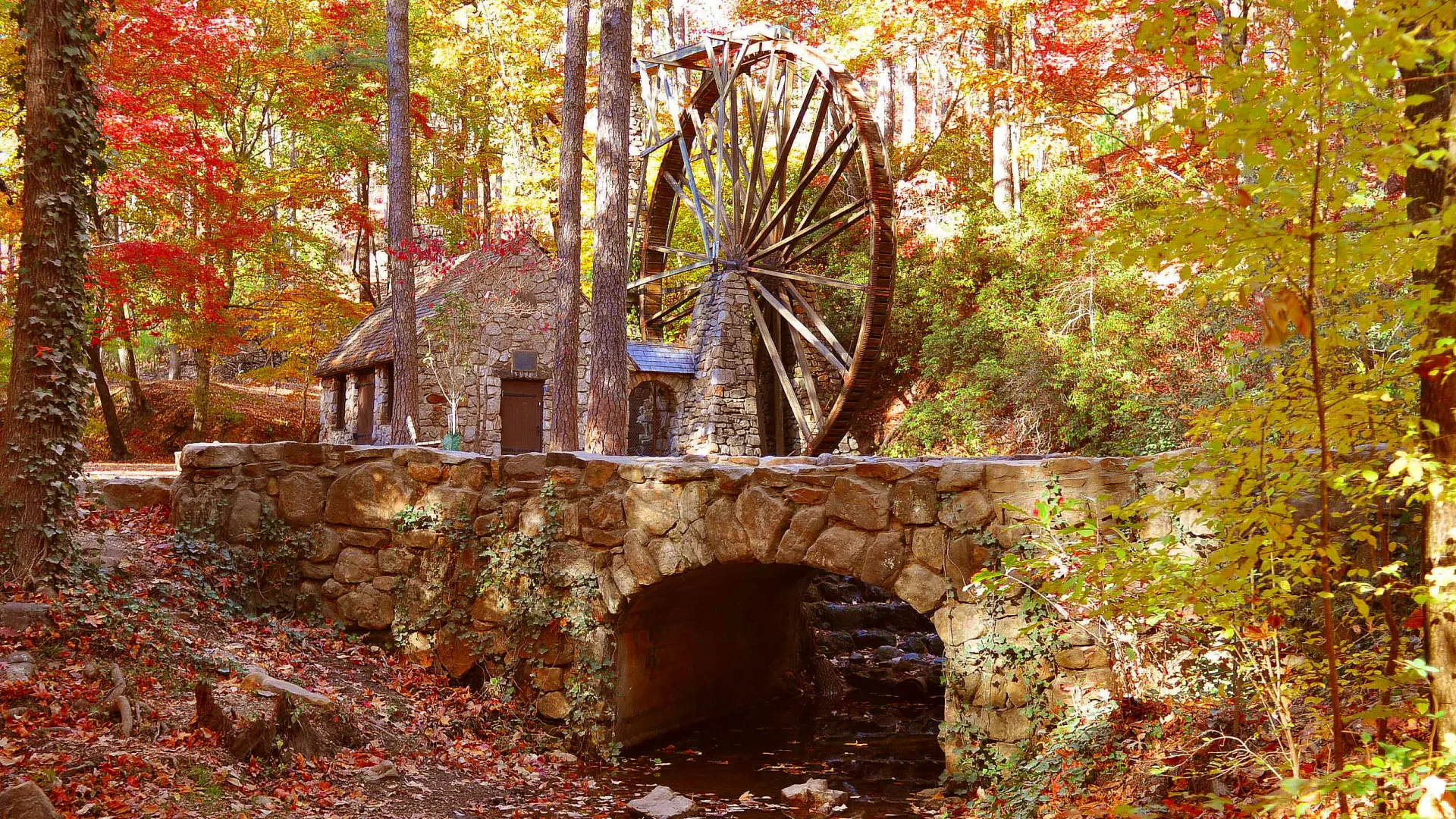 a stone bridge over a stream