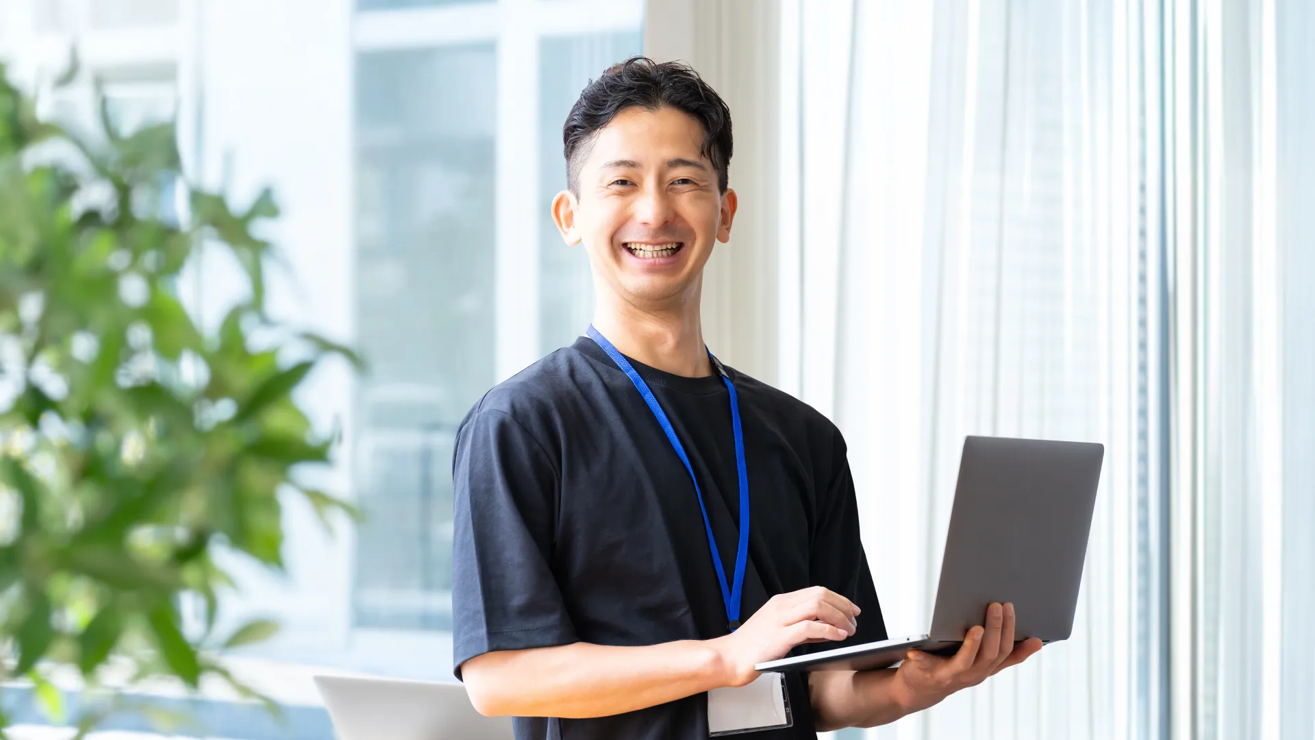 a person holding a laptop