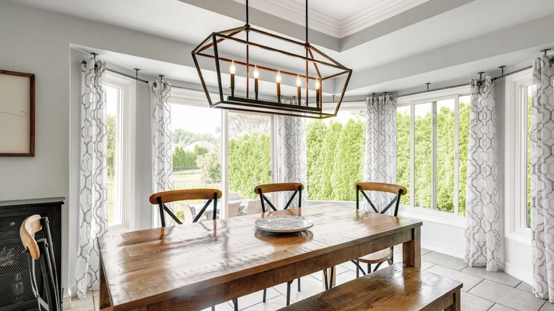a dining table with a chandelier above it