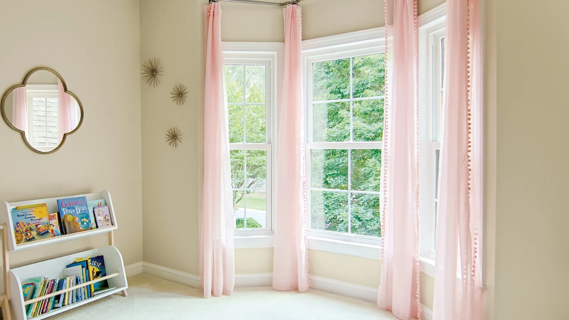 a room with pink curtains