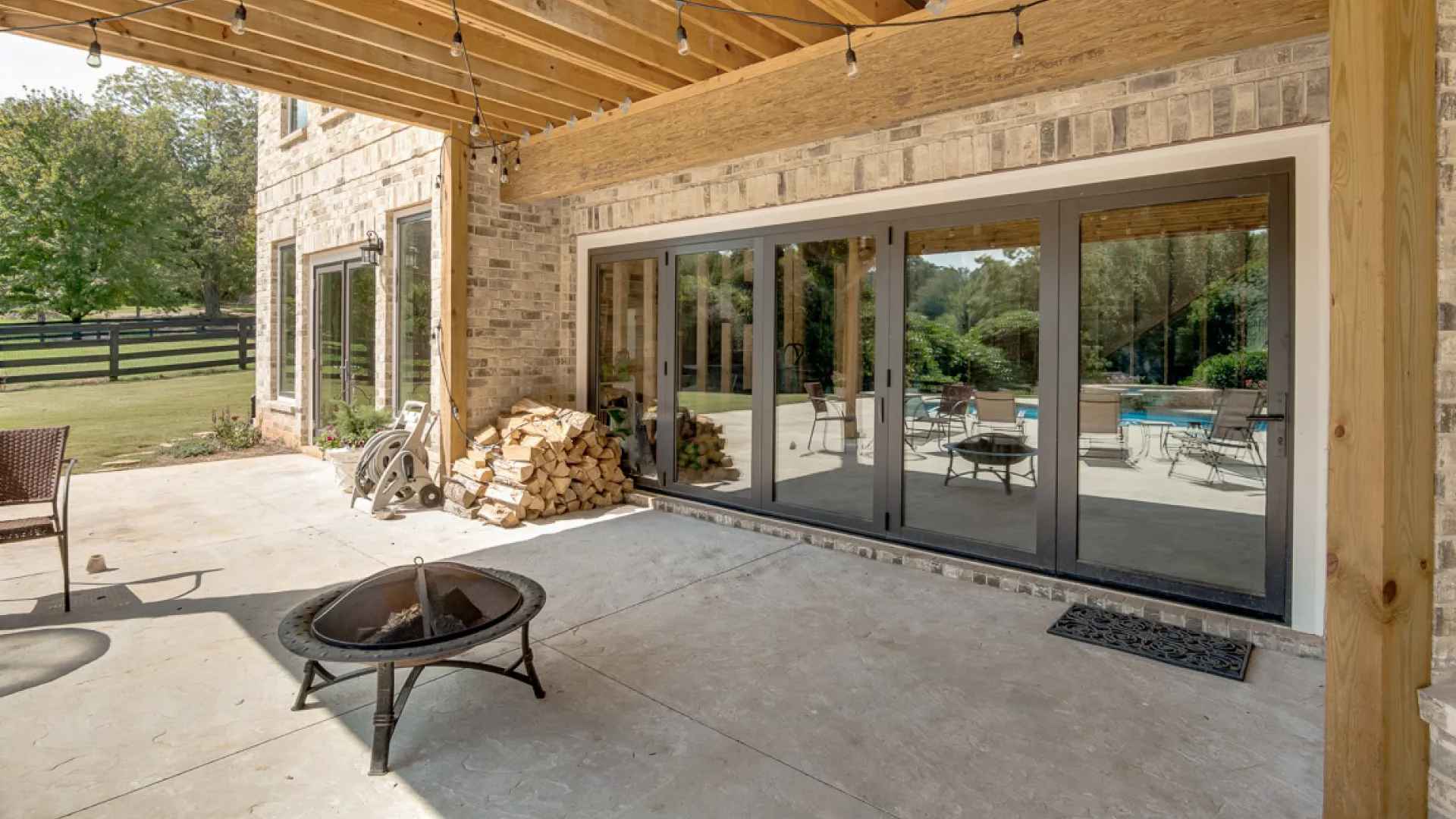 Multi-Slide Patio Doors - Black bifold patio doors installed as patio doors
