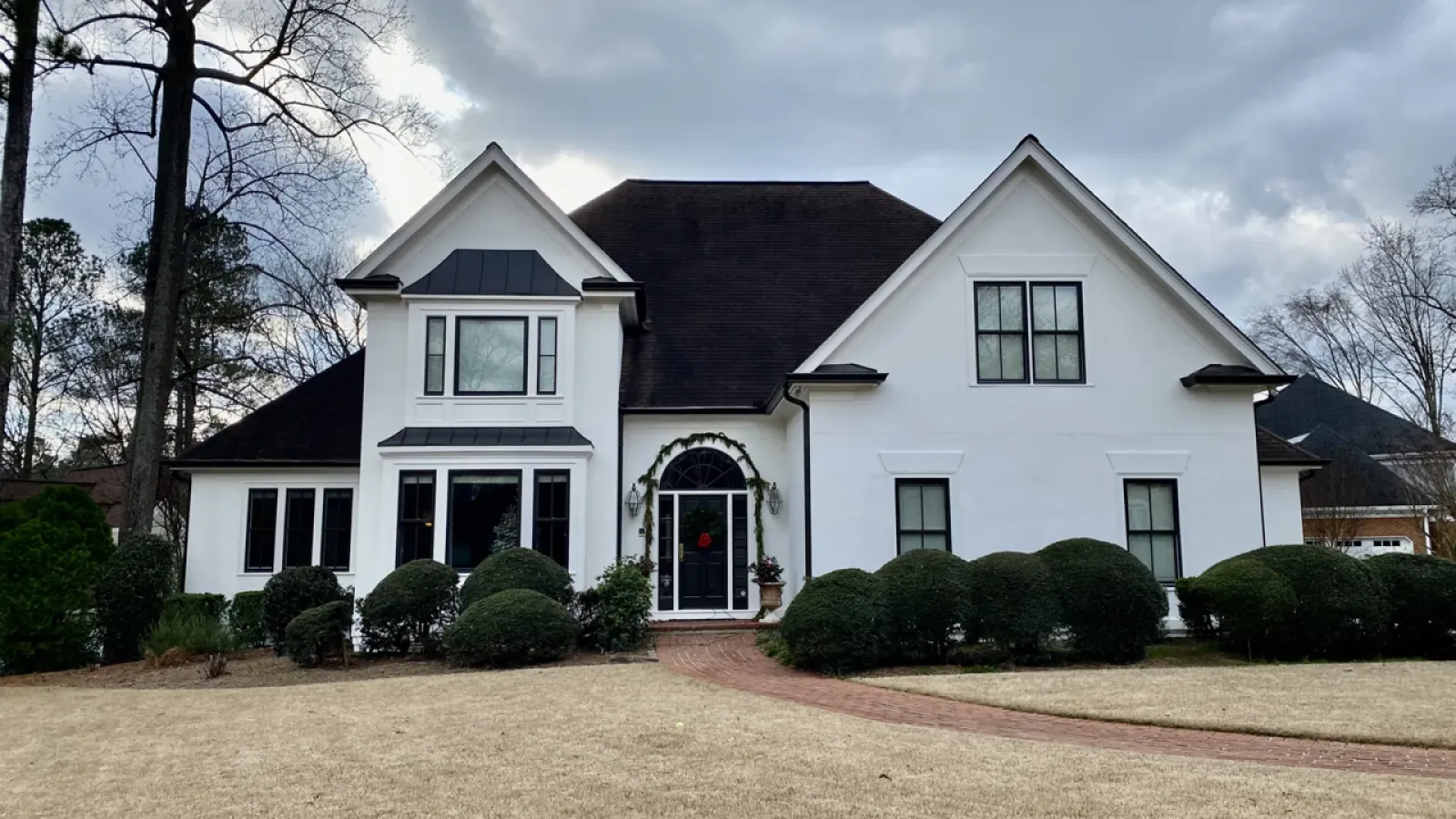 a white house with a driveway