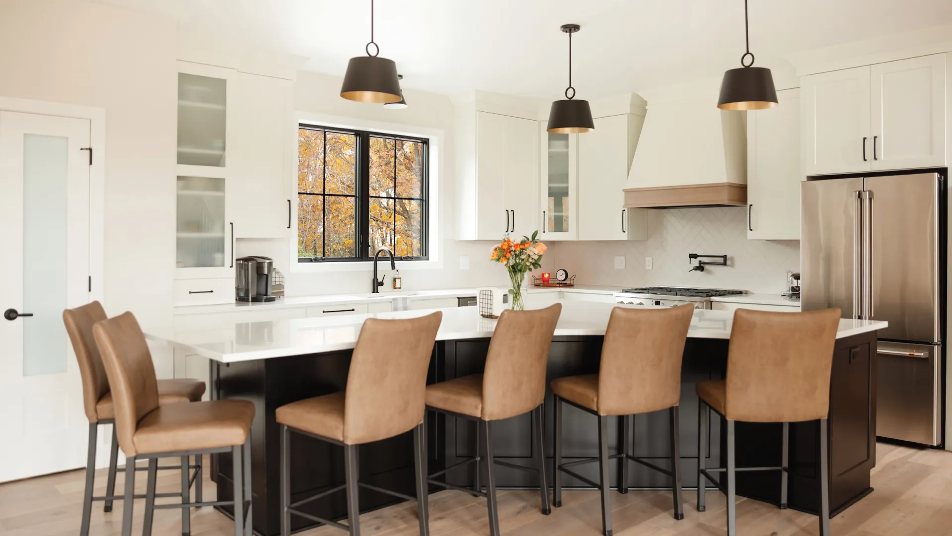a kitchen with a table and chairs