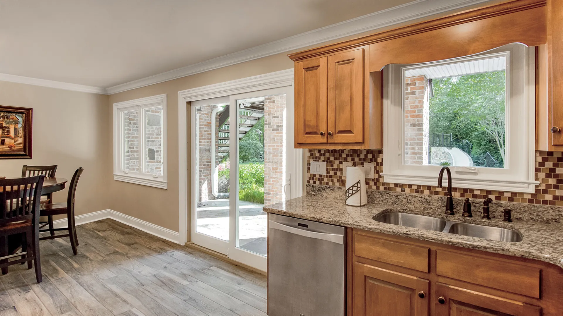 a kitchen with wooden cabinets