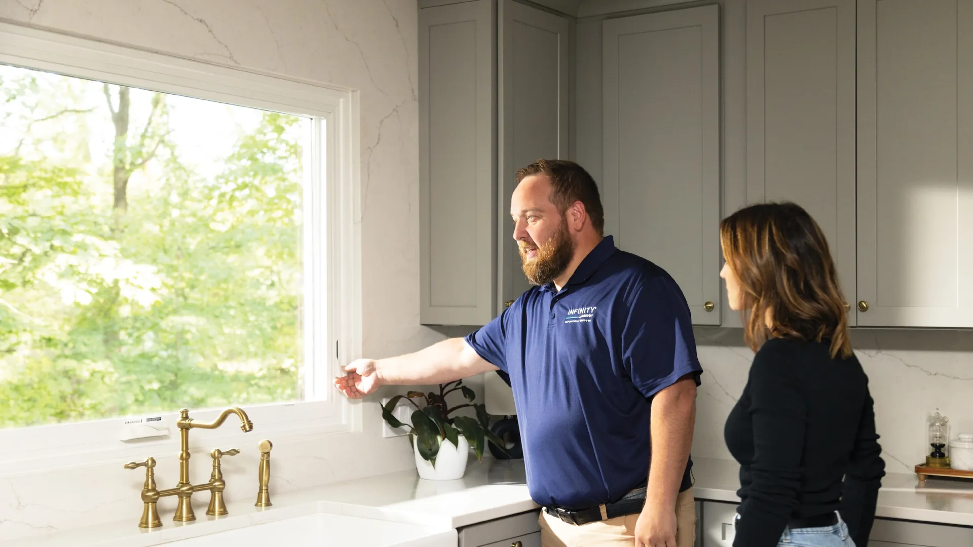 a man and a woman in a kitchen