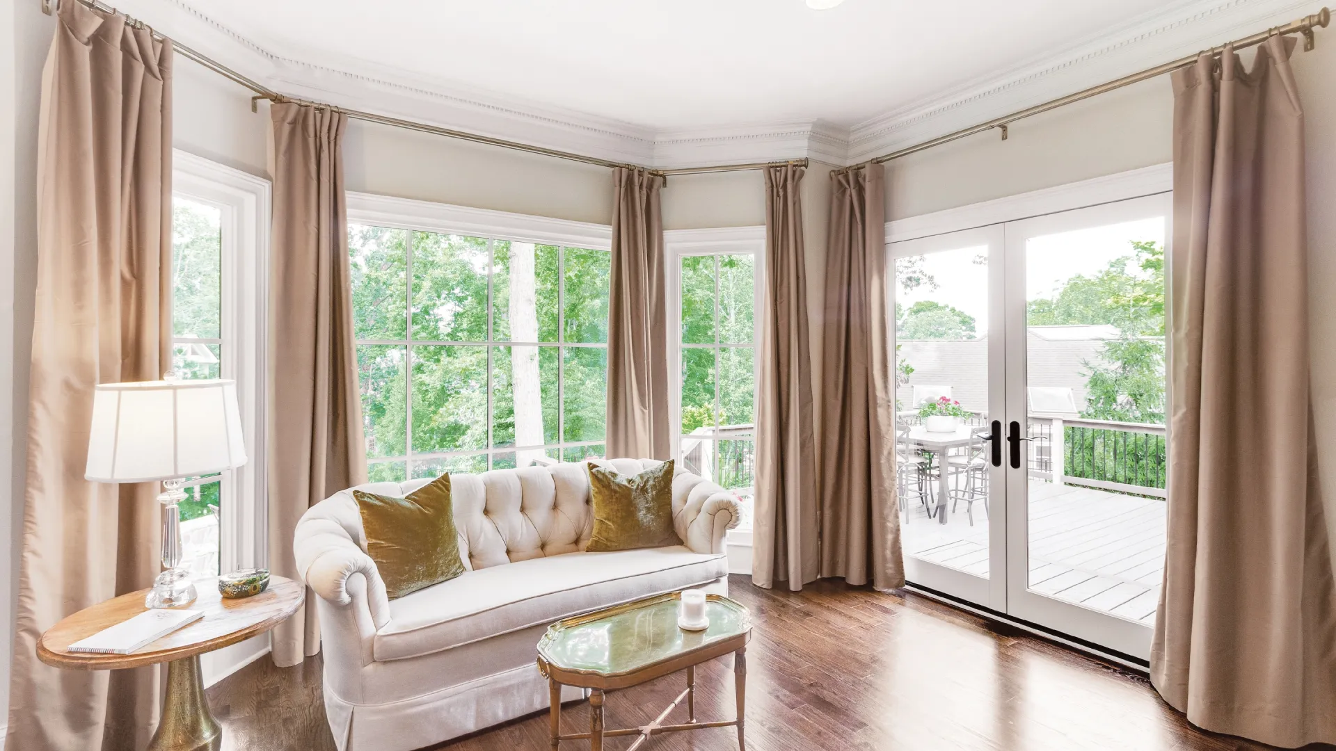 Comfortable seating area with white couch and inswing French patio door.