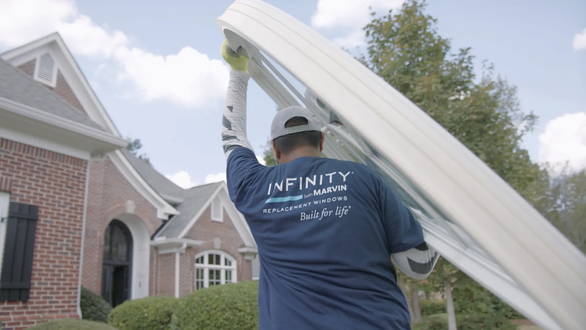 a man holding a large white sheet over his head