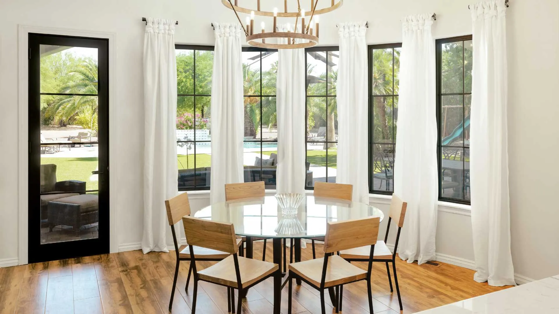 a dining room table with chairs around it