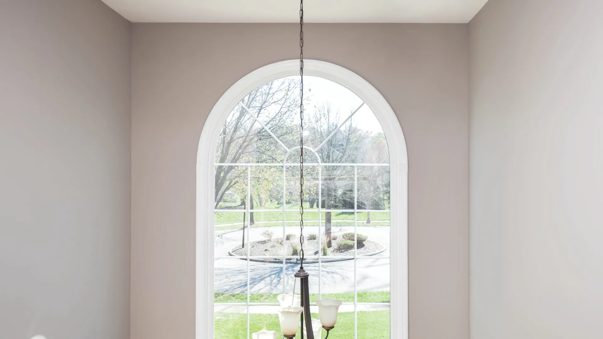 A large North Georgia brick house with round top windows