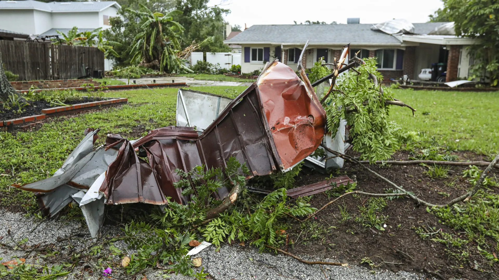 storm damage in front of a house