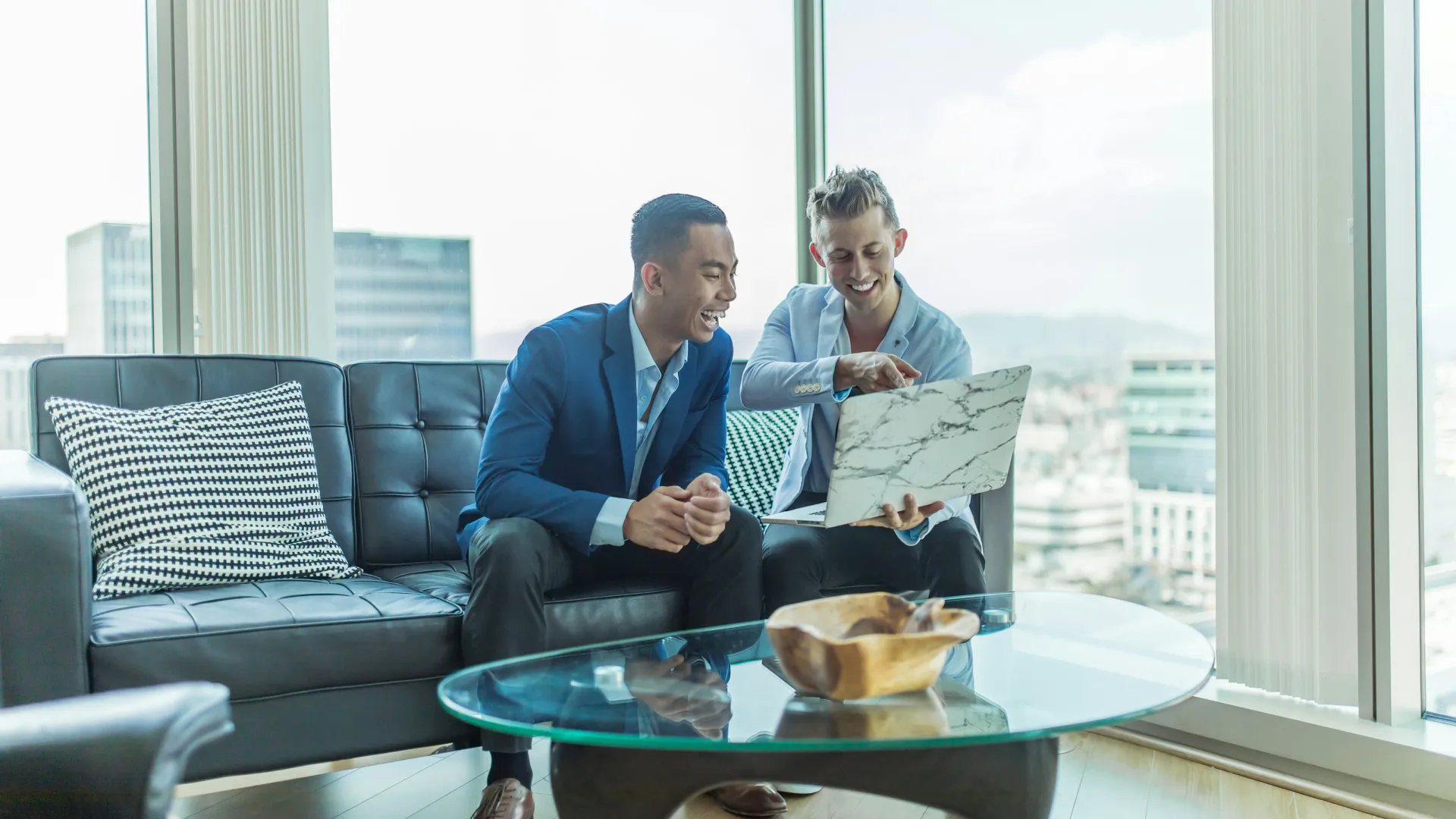 men sitting on a couch