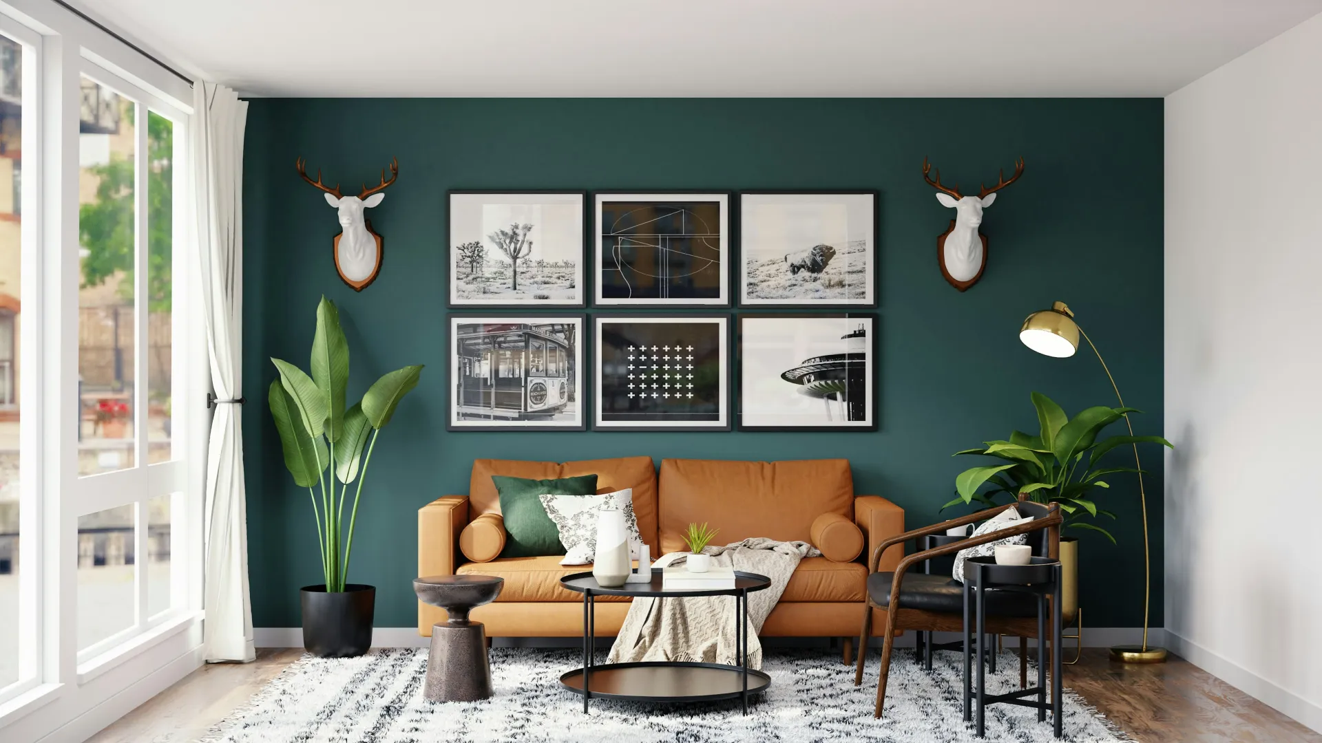 Modern living room with teal accent wall, leather sofa, wall art, plants, and wooden floor under natural light.
