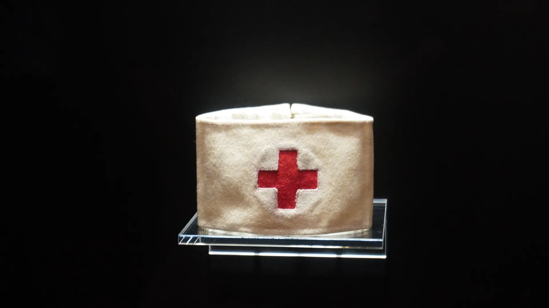 a white square with a red circle on it