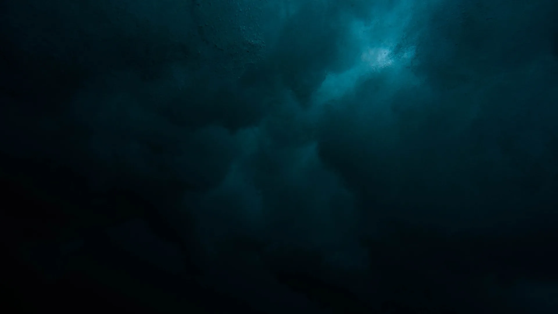 a dark sky with clouds