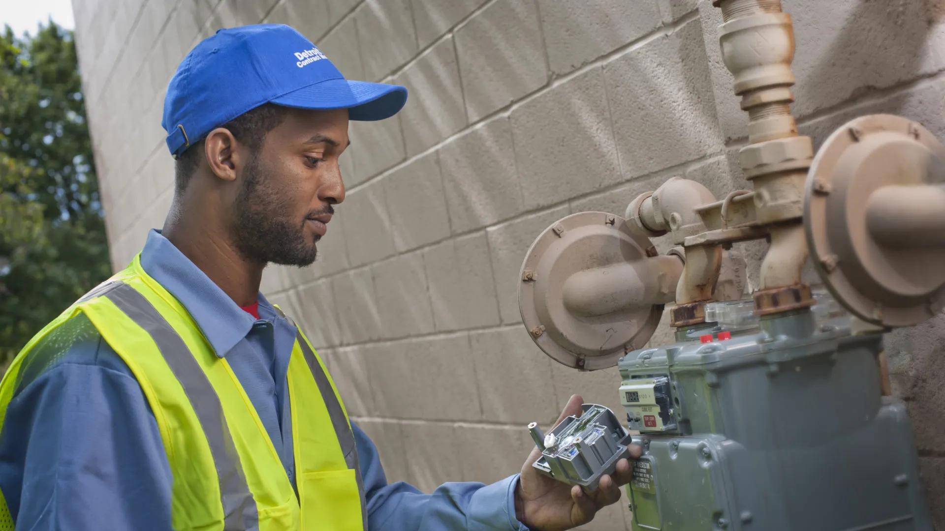 a man holding a machine