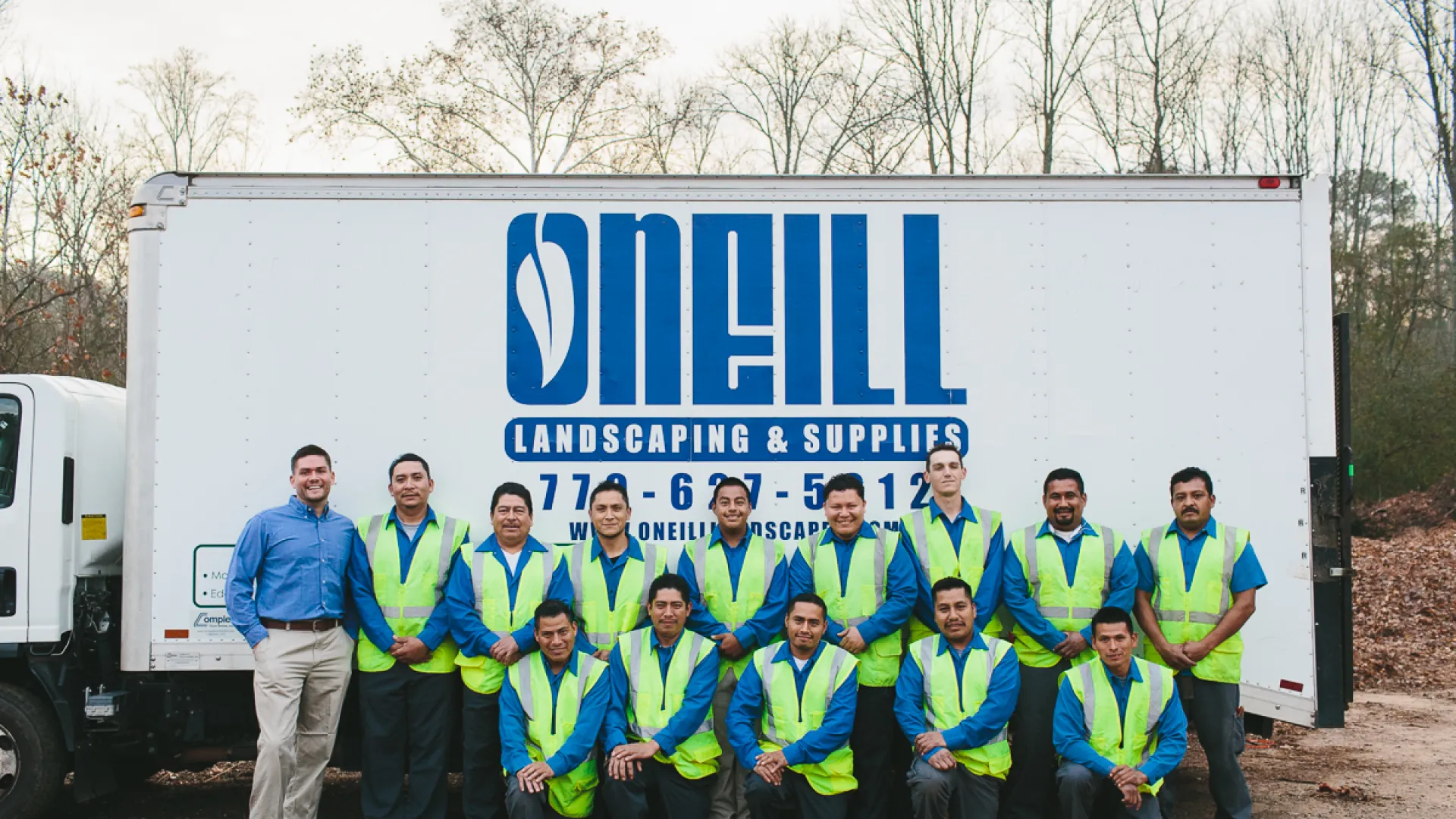 a group of people in front of a truck