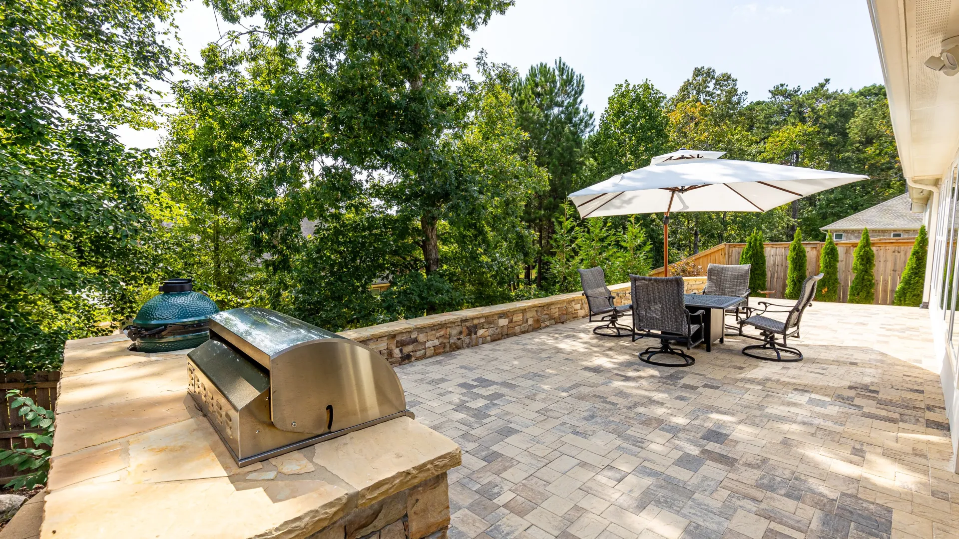 a patio with chairs and umbrellas