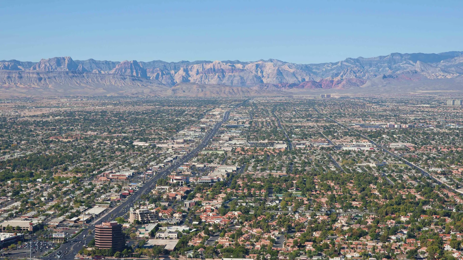 a city with mountains in the background